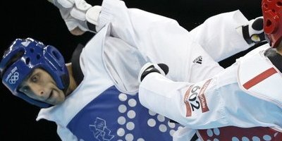 عکس هایی از نخستین رقابت نثار احمد بهاوی در المپیک 2012 مقابل حریفی از مراکش