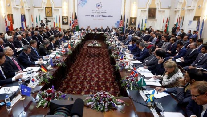 Foreign delegation members listen as Afghan President Ashraf Ghani delivers a speech during a peace and security cooperation conference in Kabul, Afghanistan June 6, 2017.