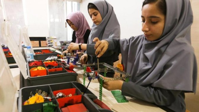 Members of Afghan robotics girls team which was denied entry into the United States for a competition, work on their robots in Herat province, Afghanistan July 4, 2017.
